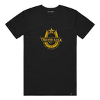 A black short-sleeve crewneck t-shirt featuring a gold graphic on the chest with a star, horseshoe, and the text 'CREATE LUCK'.